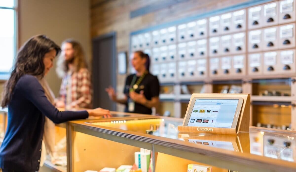 people at a cannabis dispensary counter